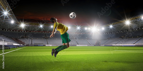 Soccer player at sport arena © Sergey Nivens
