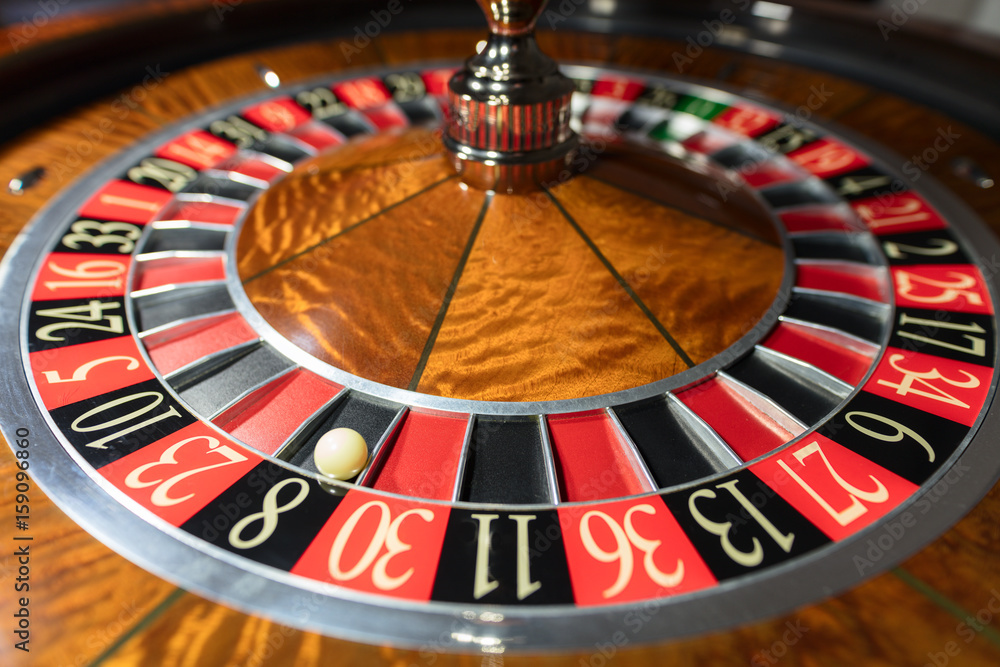 American Roulette wheel with a ball in the number '8' American Roulette wheel with a ball in the number '8'