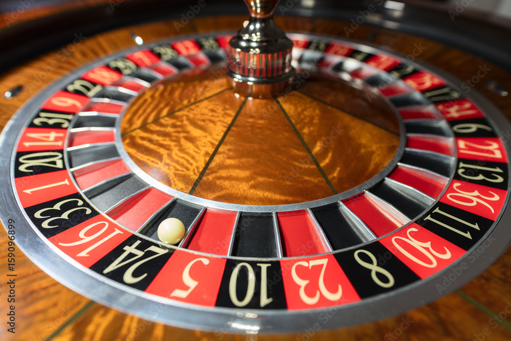 American Roulette wheel with a ball in the number '24' Stock Photo | Adobe  Stock