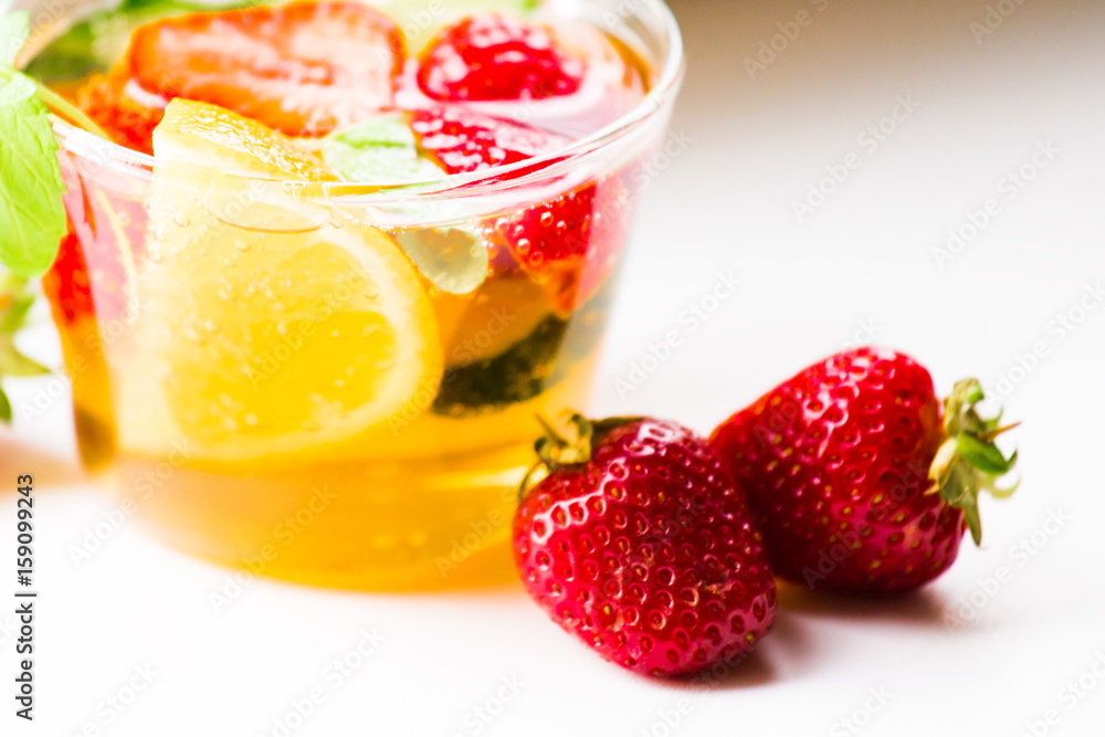 Drink. Pimms in tea cup, white background Drink. Pimms in tea cup, white background