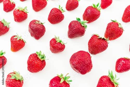 Juicy strawberry on white background. Summer berries. Flat lay, top view