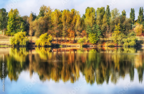 reflection. On the bank of the autumn river
