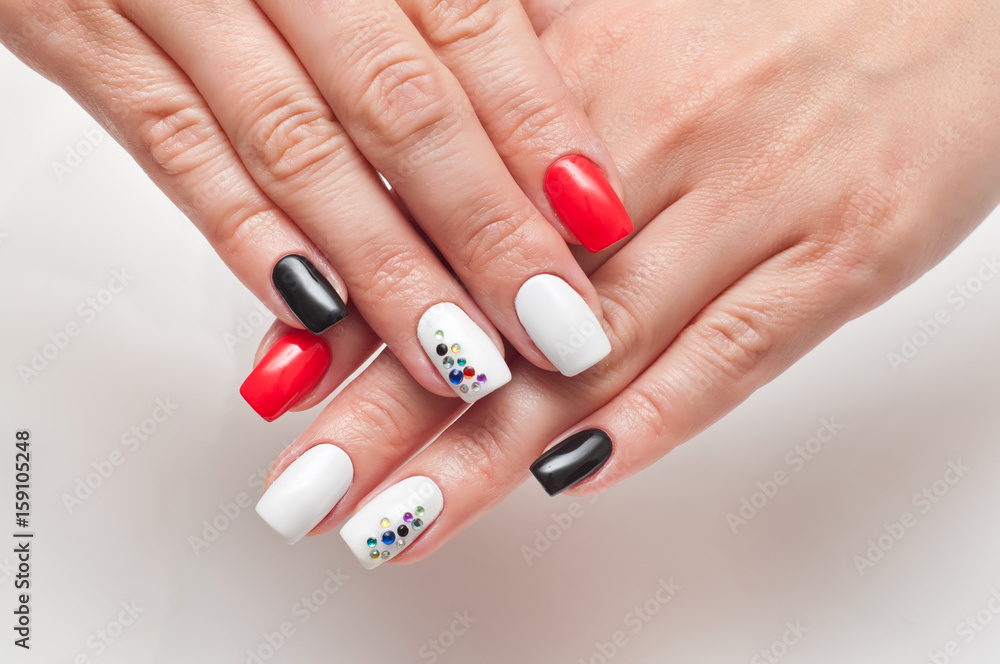 Bright manicure red. black and white on square long nails with crystals  Stock Photo | Adobe Stock