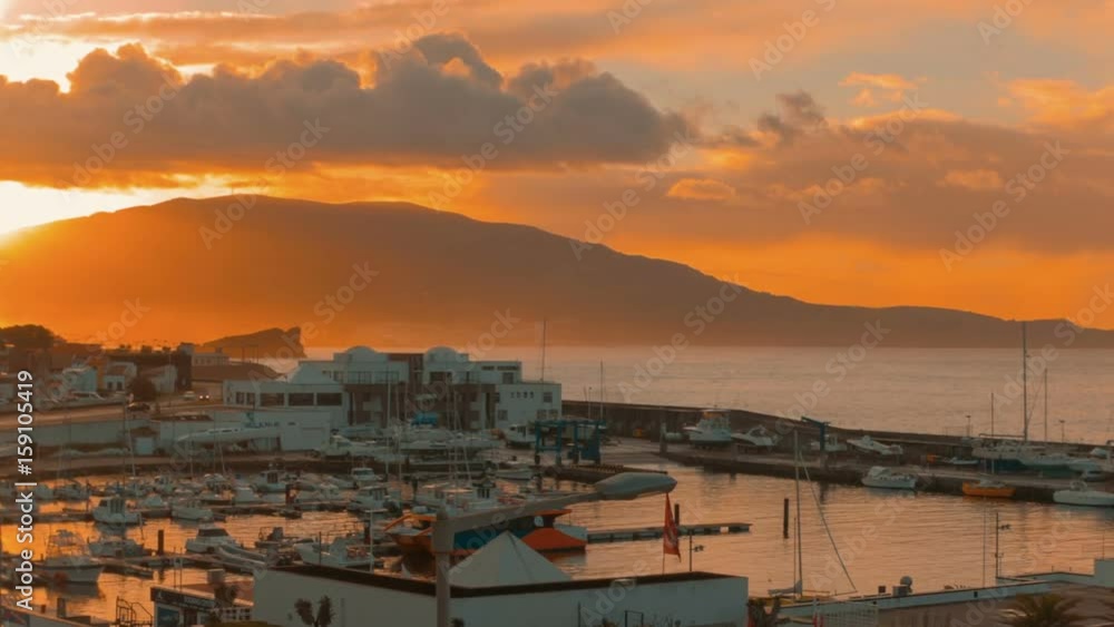 Spectacular sunrise panorama in Ponta Delgada, capital of the island of Sao Miguel, The Azores, Portugal. The archipelago of the Azores is one of the hidden gem holiday destinations in Europe. Spectacular sunrise panorama in Ponta Delgada, capital of the island of Sao Miguel, The Azores, Portugal. The archipelago of the Azores is one of the hidden gem holiday destinations in Europe.
