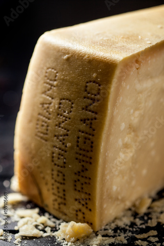 Slice of parmesan cheese showing name 