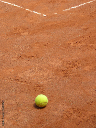 Ball on the clay tennis court