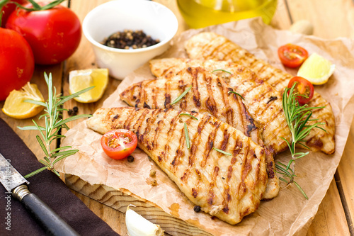 Grilled pork escalopes with rosemary and cherry tomatoes