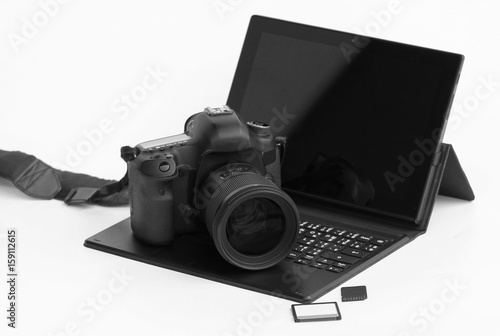 Close-up DSLR Camera lens on laptop.