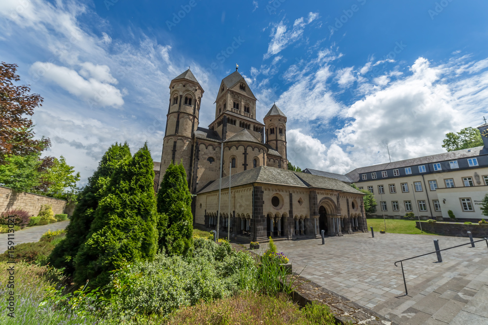 Fototapeta premium Old medieval benedictine Abbey in Maria Laach, Germany, first founded in 1093. Detail on its garden and side view