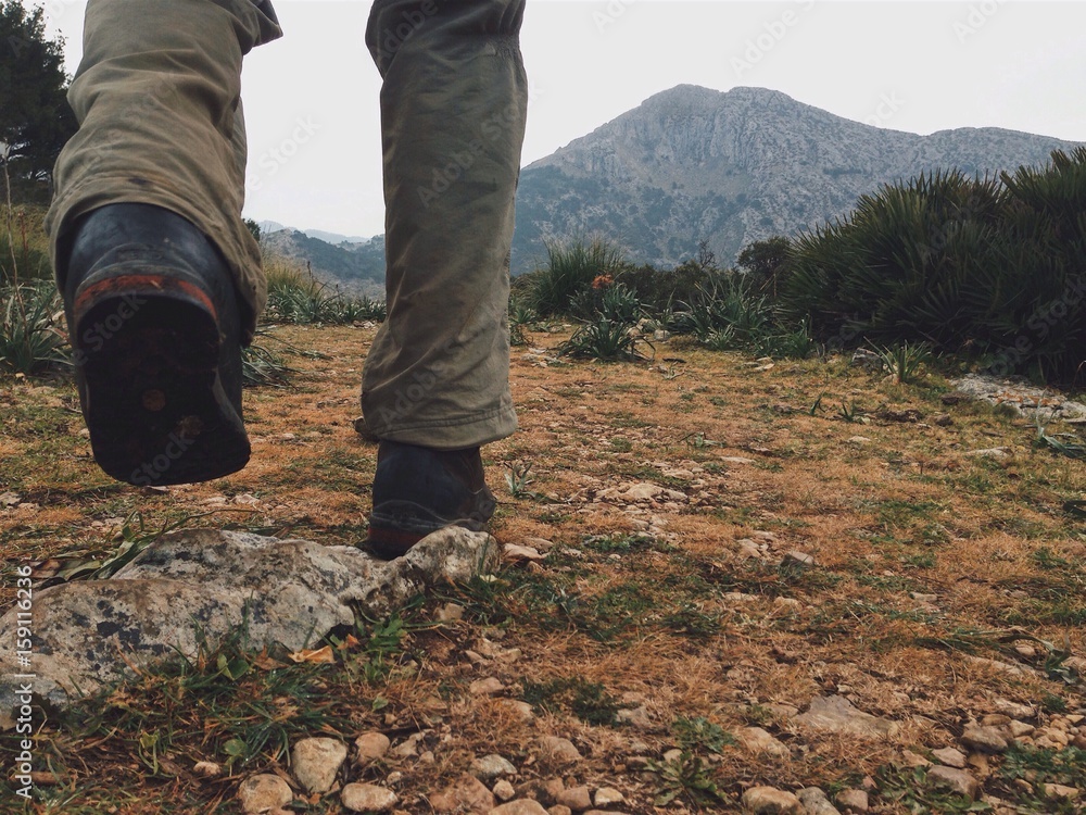 Hiker in the Tramuntana mountains, Mallorca, Spain - obrazy, fototapety, plakaty 