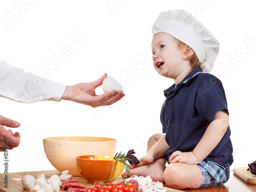 Child in the cook cap with ...