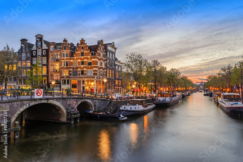 Amsterdam city skyline at canal waterfront when sunset  Amsterdam  Netherlands
