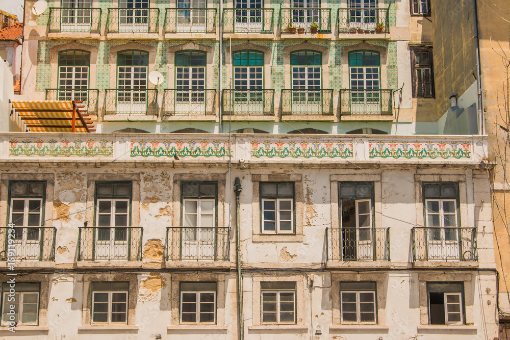 Typical colorful rusty facades wall on houses in Lisbon, Portugal