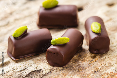 Obraz na plátně Handmade luxury chocolates with pistachio