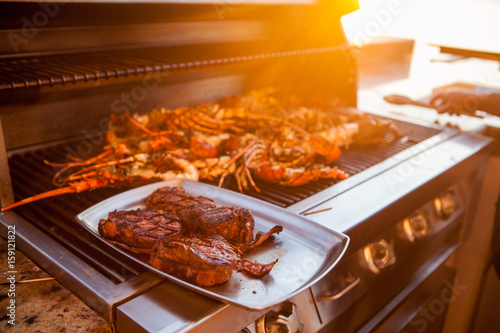 Grilling Surf and Turf Outside in the Sunset