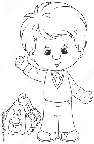 Little schoolboy smiling, standing with his schoolbag and waving in greeting