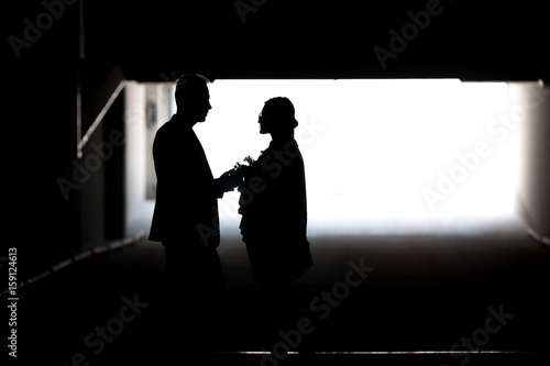 Silhouette of a couple in love. Black and white photo.