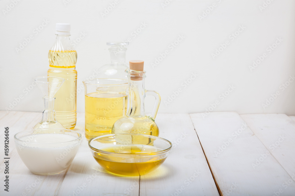 bottle of aroma essential oil or spa and natural fragrance oil with dry flower on wooden table, image for aroma spa alternative therapy medicine and meditation aroma concept. bottle of aroma essential oil or spa and natural fragrance oil with dry flower on wooden table, image for aroma spa alternative therapy medicine and meditation aroma concept.