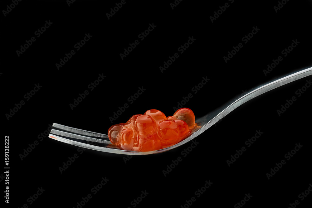 The fork with red caviar
