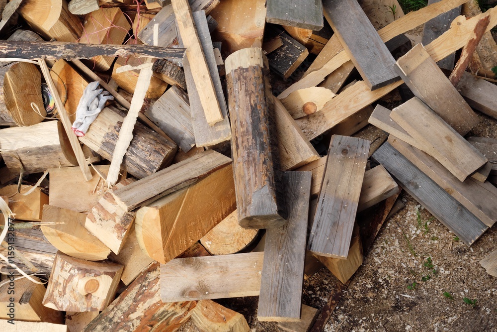 Firewood in the yard different sizes Firewood in the yard different sizes