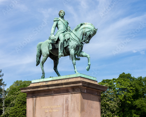 Canvas Print Statue of former Swedish King Karl XIV Johan sitting on its horse outside the royal palace in Oslo