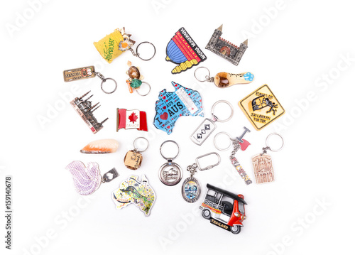 Various souvenirs fridge magnet and key chains from world countries on a white background