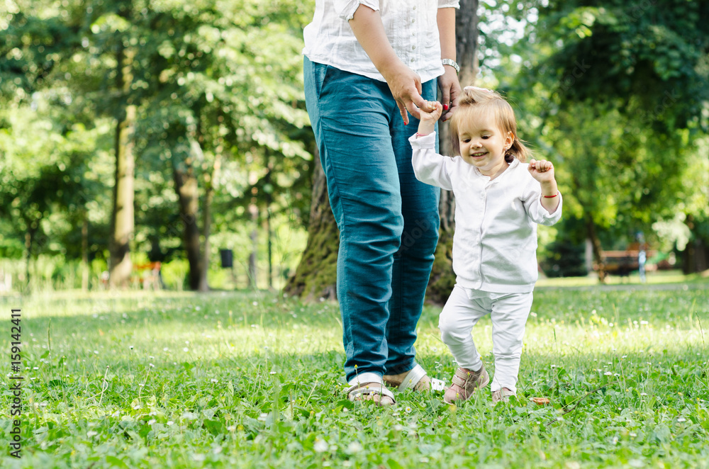 Obraz premium baby walking first step