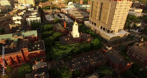 Epic shot zooming out from a clock tower and revealing Boston skyline photo