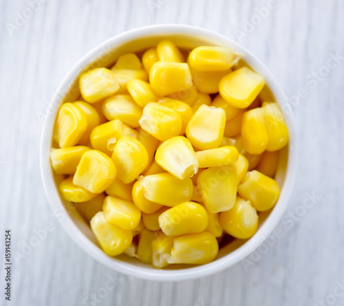 corn in a bowl on wood