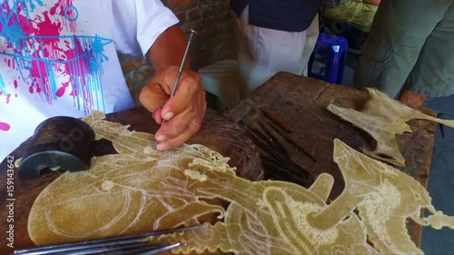 Making wajang puppets on Java Indonesia photo