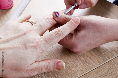 manicure procedure in beauty salon