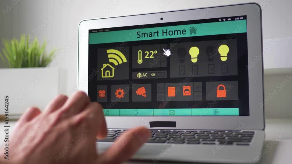 Changing the temperature of a house using a laptop computer. Smart home application on a computer. Changing the temperature of a house using a laptop computer. Smart home application on a computer.