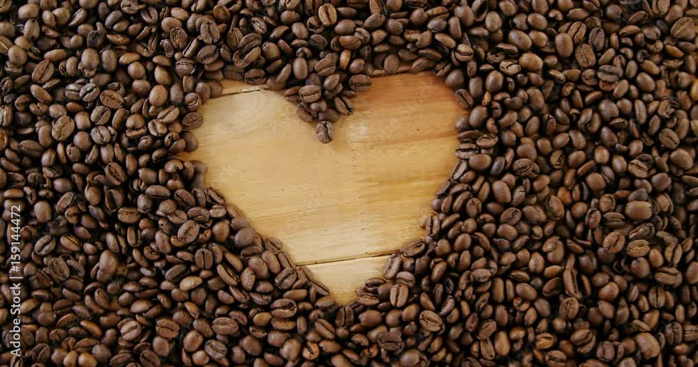 Coffee beans forming heart shaped Coffee beans forming heart shaped