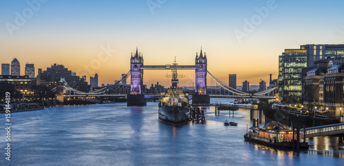 Panorama view of Tower Bridge and HMS Belfast at sunrise in London