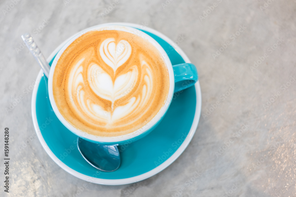 Cup of hot latte art coffee