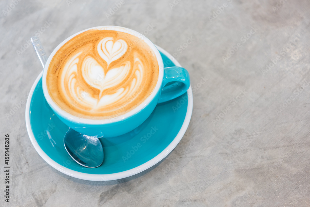 Cup of hot latte art coffee