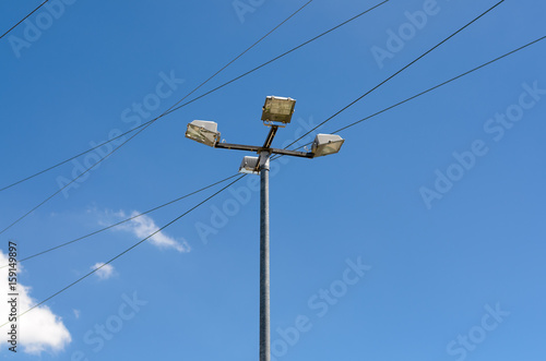 Electric cables with a street lamp