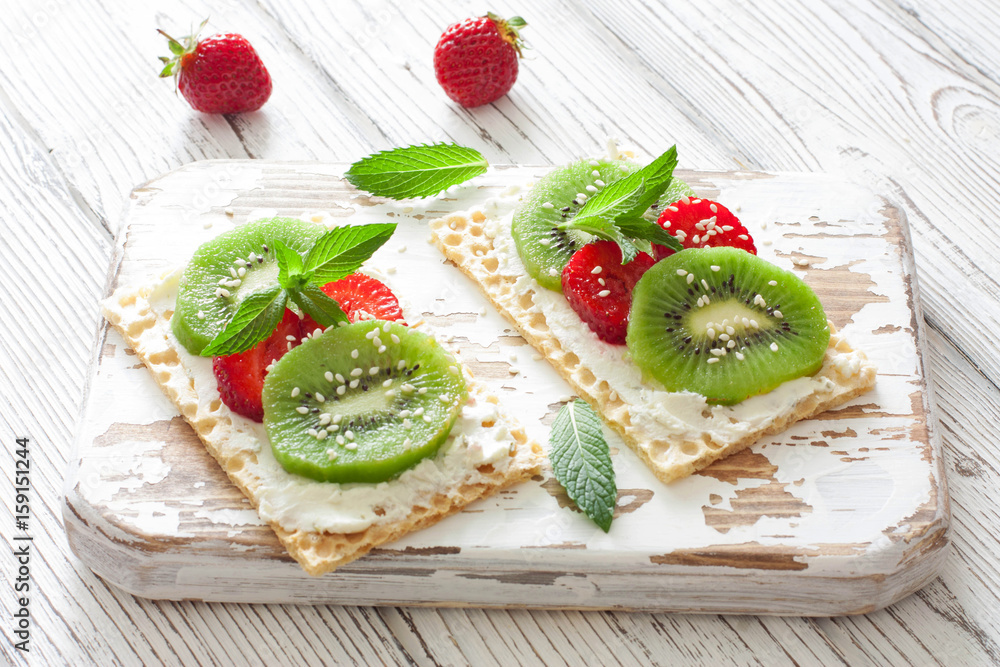 Waffles with soft chese, strawberries and kiwi Waffles with soft chese, strawberries and kiwi