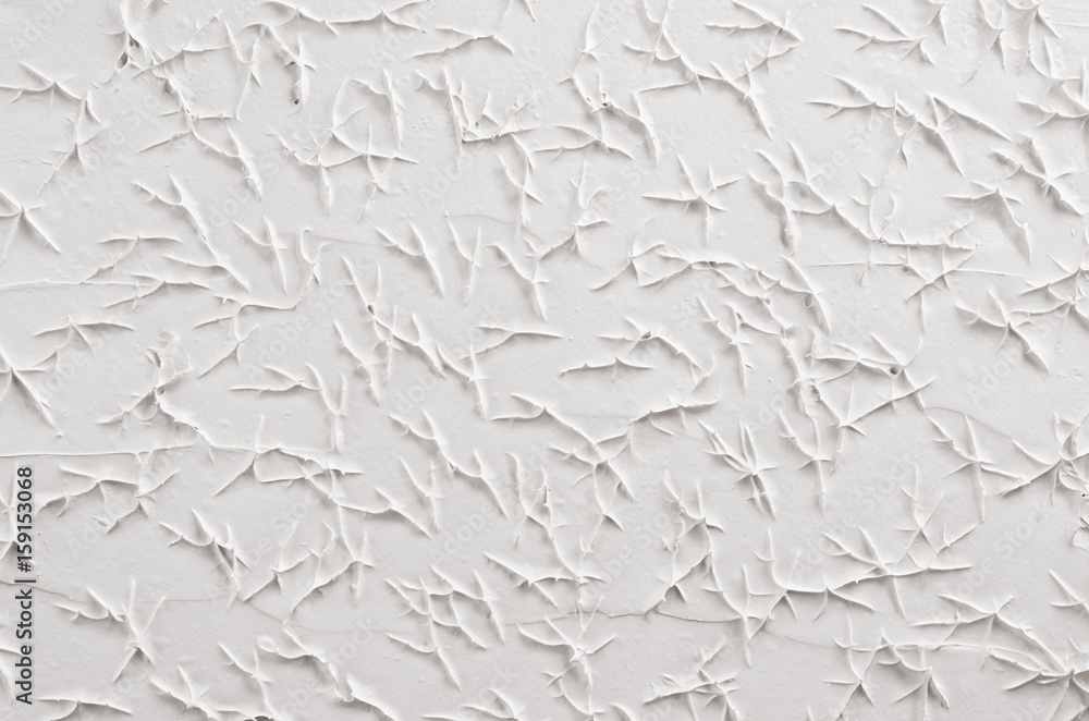 White decorative abstract plaster texture with cracks, splash, footprints. White decorative abstract plaster texture with cracks, splash, footprints.