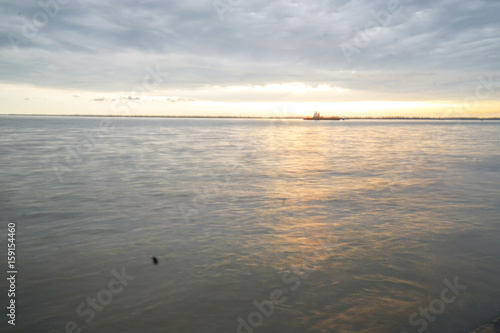 Sunset at tourist spot in Klang, Malaysia. Low light,vibrant colour and noise. © tuahlensa