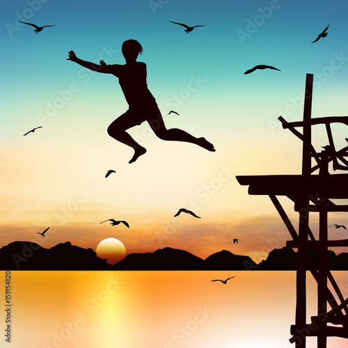 Silhouette and jumping girl in the twilight with blue sky.
