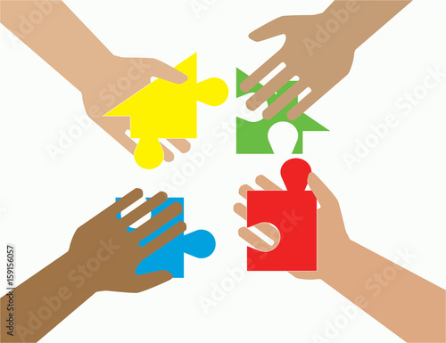 Four hands putting multicolor puzzle pieces together. Teamwork, cooperation, business, solution, work concept.