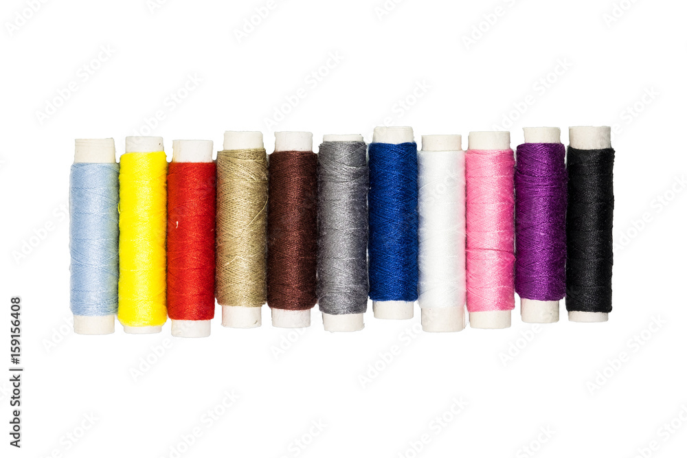 Colored thread coils on white background Colored thread coils on white background