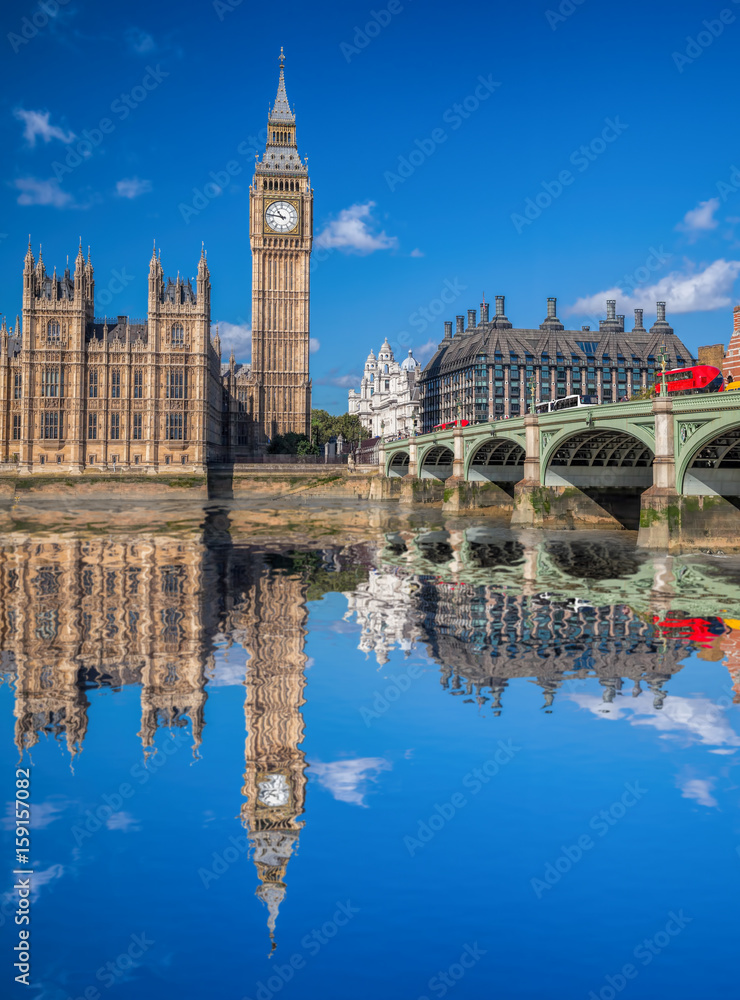 Fototapeta premium London with red buses against Big Ben in England, UK