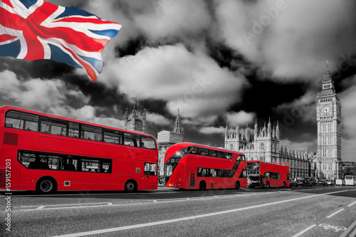 London with red buses against Big Ben in England, UK photo