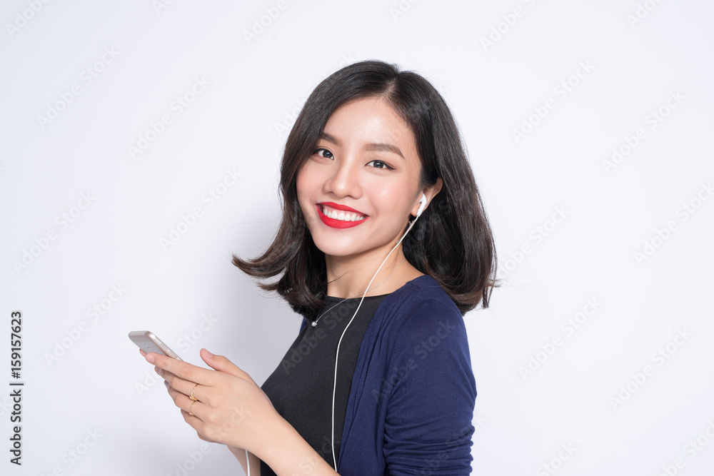 Young asian woman using smartphone isolated on white. Young asian woman using smartphone isolated on white.
