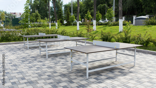 Some ping pong tables in a public park