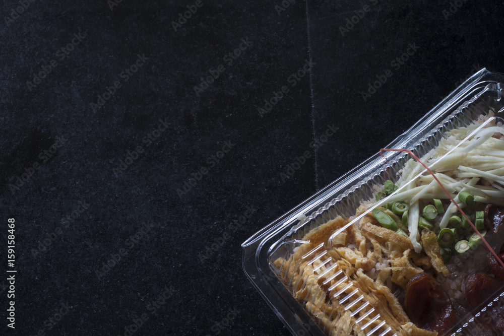 Rice Mixed with Shrimp paste in plastic box on tile black color. - obrazy, fototapety, plakaty 