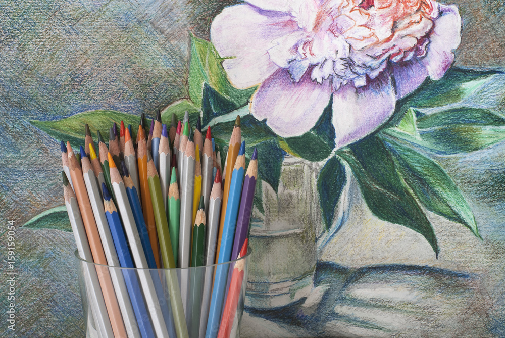 Fototapeta premium A bunch of colored pencils on the background of a drawing with colored pencils