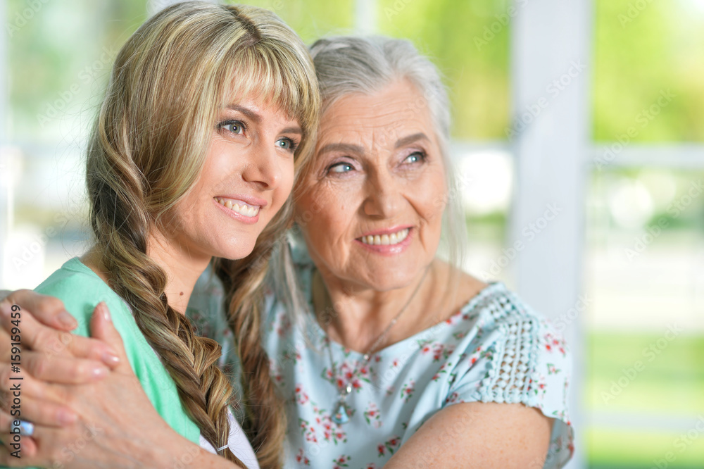 Beautiful young woman with mother Beautiful young woman with mother